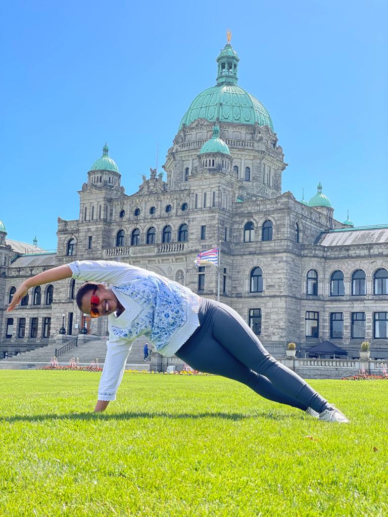 Grasie doing Pilates in front of the BC Parliament, Victoria